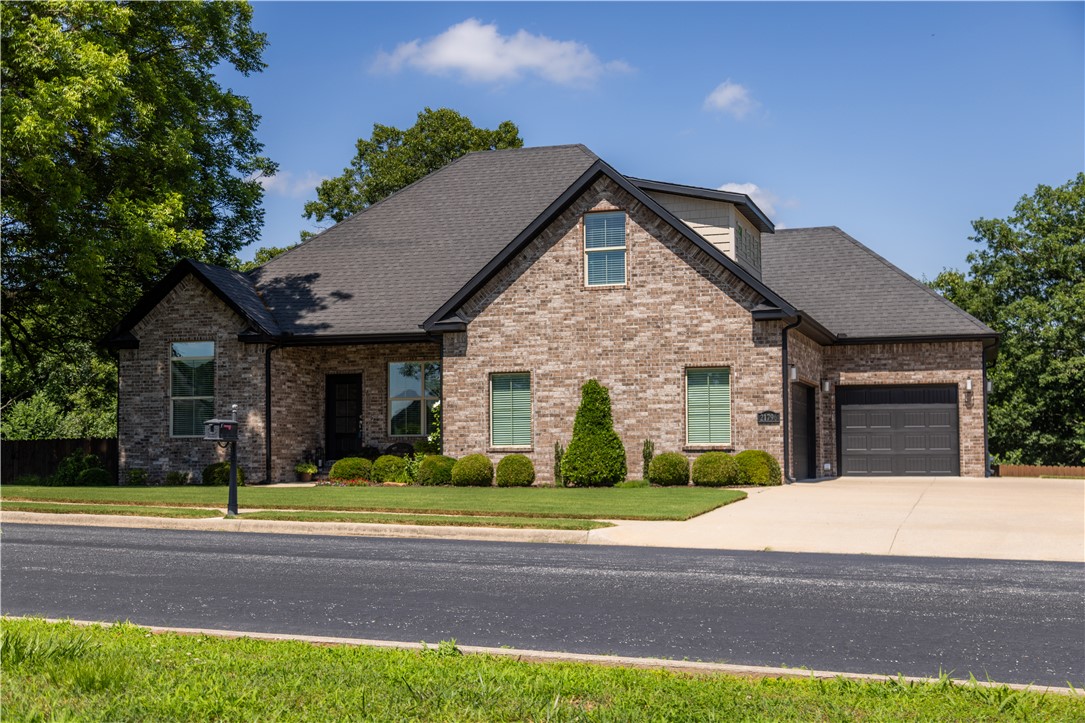 Nestled in the desirable Beaver Lake area with community lake access, this beautiful brick home offers the perfect blend of space, comfort, and beautiful natural surroundings. Situated on a picturesque one-acre lot with both wooded and open areas, you'll enjoy stunning views of mature shade trees from the expansive two-level back deck, featuring a covered entertaining area. The welcoming covered front porch and gorgeous landscaping create exceptional curb appeal and views of rolling hills and pastureland. Located in a cul-de-sac neighborhood with a shoreline boat launch and adjacent walking trails, this property is ideal for outdoor enthusiasts. Inside, the open-concept floor plan features a spacious living area, formal dining room, and kitchen with breakfast nook. The home offers 4 bedrooms and 3 bathrooms, plus an upstairs bonus room that can serve as a 5th bedroom or game room. Additional highlights include a 2-car garage plus an extra-deep 1-car garage perfect for boat storage, a workshop, or storage space.