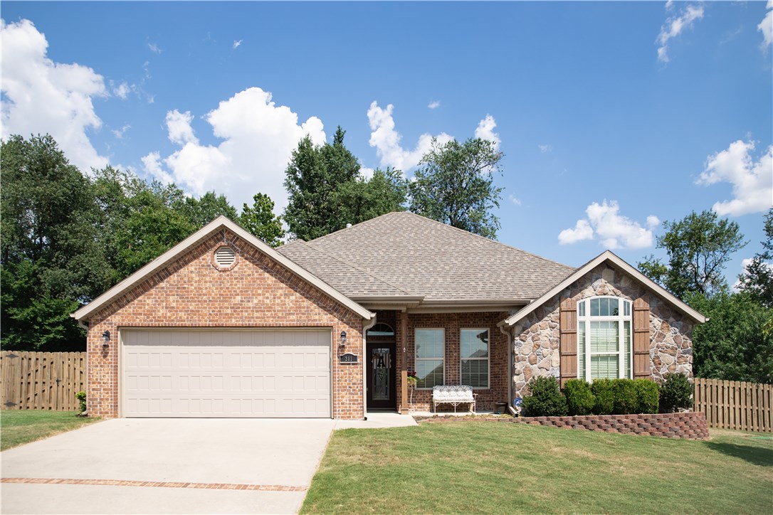Stylish 3BR, 2BA home with an office.  Convenient location in Weatherton S/D/  This full brick home will WOW you from the moment you walk in.  Crown moldings. engineered hardwood floors adorn this spacious living room accented by a floor to ceiling raised hearth fireplace.  Kitchen features granite counters, staggered white cabinets and modern tile floors.  Oversized eat in kitchen with above bar pin lighting.  Master bedroom has all the amenities you would expect in this upscale home.  Enjoy the covered patio surrounded by a spacious backyard that backs up to a greenspace.  RD eligible.