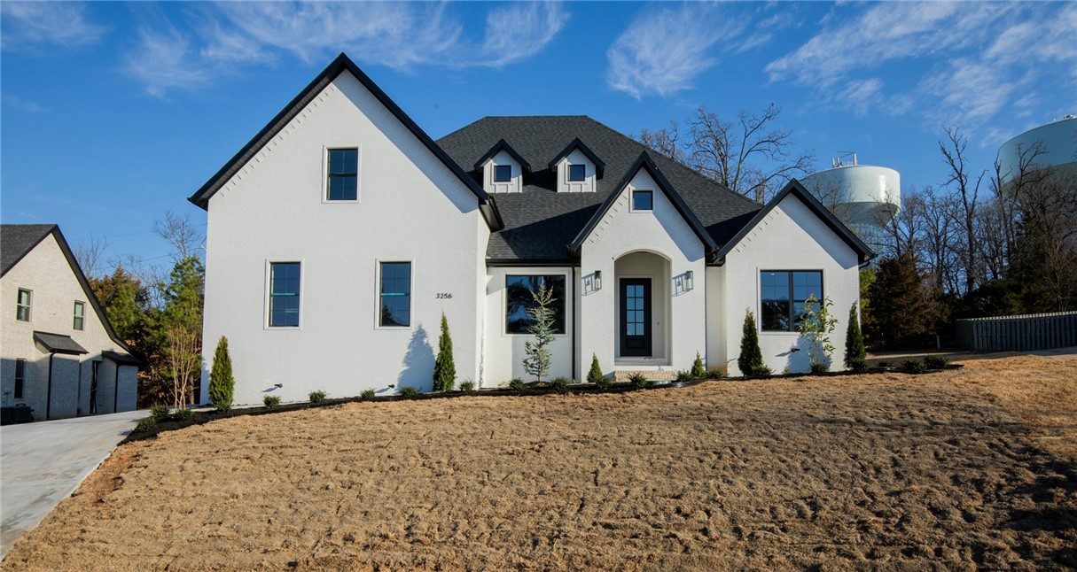 Seize the opportunity to own a stunning, newly-built modern home in the coveted Sloan Estates neighborhood in East Fayetteville. Situated on one of the final available lots, this luxurious home offers an expansive main living area, 4 spacious bedrooms, and 4 elegant bathrooms.
The chef-inspired kitchen is a culinary haven, featuring double ovens, a gas stovetop with pot filler, a large island with waterfall quartz countertops, and a walk-in pantry. The master suite is a true retreat with an oversized closet complete with built-in storage solutions, a double vanity, a vessel tub, and a marble-tiled shower.
This thoughtfully designed home includes a second main-floor bedroom and a versatile second-floor bonus room. Enjoy the warmth and beauty of hardwood floors, complemented by a grand floor-to-ceiling fireplace and a generous office space.
Located just minutes from Vandergriff and McNair schools, as well as local grocery stores and restaurants, this exquisitely appointed home offers both luxury and convenience.