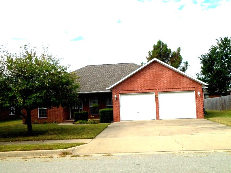 Location! Location! Location! Wonderful family home close to shopping, schools, Girls and Boys Club and I-49. One owner home.All brick exterior.Split BR floor plan. Formal dining room or office with French doors, Pretty laminate floor,cozy living room. bedroom w/ walk-in closet & master bath with double vanity/whirlpool tub. Great storage. Nice level yard. 8 x 30 back covered patio porch to enjoy and a 19' long front porch. With full price offer seller will give an allowance toward BCC or carpeting.