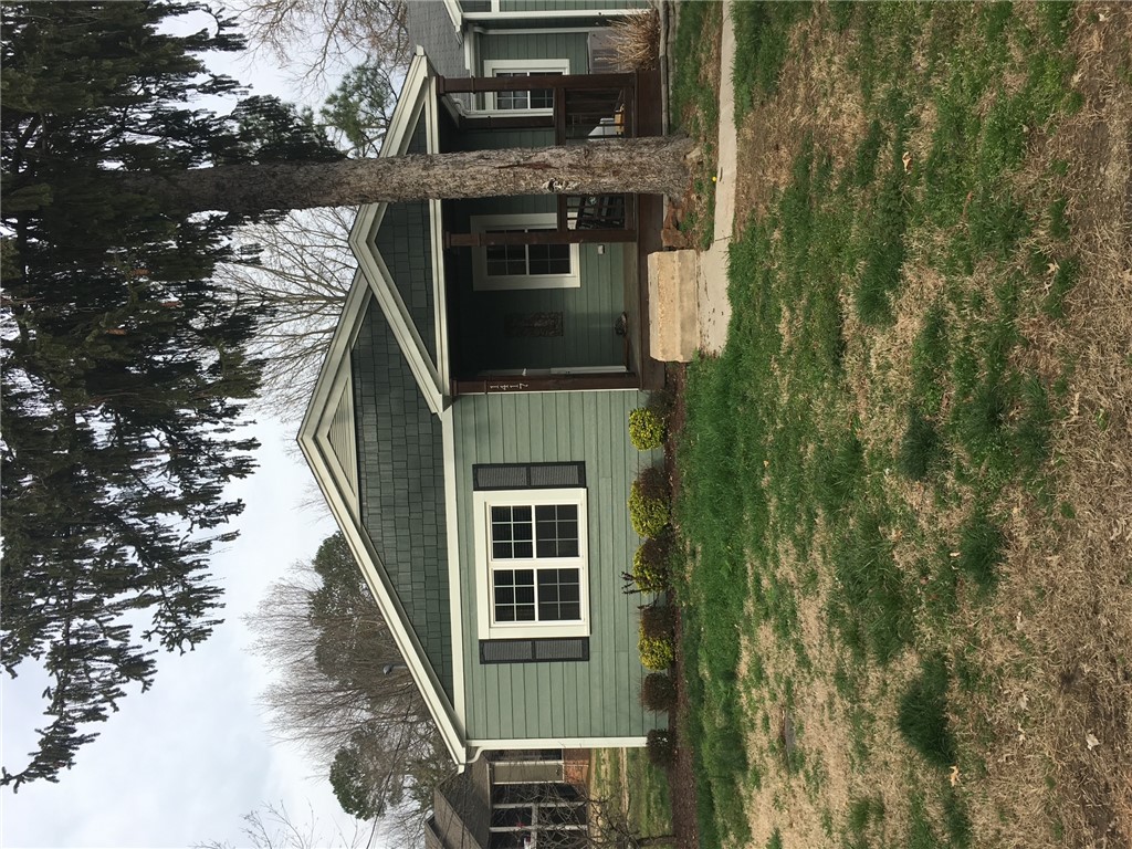 Renovated 1940's bungalow within 1 mile of the University of Arkansas, steps from the U of A's bus stop. Fenced in yard with hot tub, fire pit, and concrete patio. One garage bay has been renovated into two rooms suitable for a home offices. Large attic master bedroom with separate heating/cooling unit. Original hardwood floors. Lease in place till July 31st, 2026.
