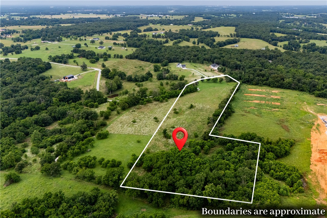 Rare opportunity in Reading Ranch Estates, a subdivision of 10+ acre lots. Build the estate you've always envisioned in this beautiful community of expansive homesites surrounded by stylish custom homes. This mostly level 10.87-acre parcel offers the perfect blend of privacy, space, and convenience, with city water, electric at the road, and protective covenants designed to preserve the quality and value of the neighborhood. Enjoy easy access to Highway 412, the new bypass, XNA Airport, Springdale, and Downtown Siloam Springs while creating the custom home you've been dreaming of.