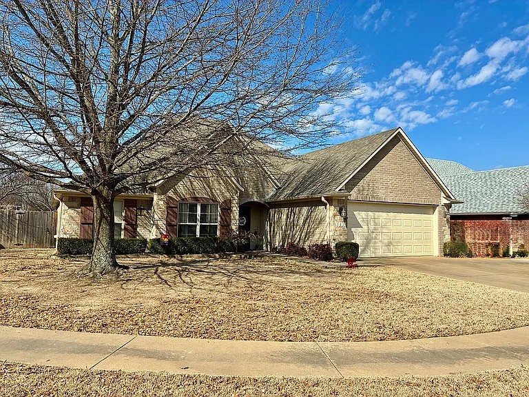 Welcome to 2479 N Surtees Place, a beautifully maintained 3-bedroom, 3-bath home offering 1,959 square feet of comfortable living in the desirable West Fayetteville area. Built in 2006, this move-in-ready home features thoughtful updates, including a dedicated office added in 2021, brand-new carpet in 2025, a new HVAC system in 2019, and a new garage door with a mini-split added in 2018. The garage provides flexible space for a workshop, gym, or hobby area. With a neutral interior and a practical layout, the home is designed for everyday ease. Situated on a quiet cul-de-sac close to schools, shopping, dining, parks, and the University of Arkansas, this property blends neighborhood comfort with convenient access to area amenities.