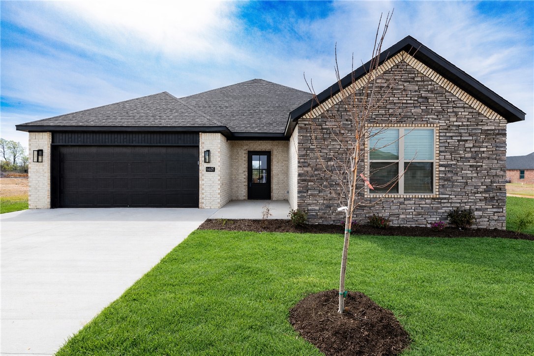 Welcome to this stunning all-brick new construction home in Walnut Grove Estates. This Bentonville subdivision is located just minutes from Vaughn Elementary, the airport, groceries, gas, & more! It boasts numerous high-end features and extras. Inside, you'll find a stone fireplace with built-in shelves on both sides, a spacious pantry, an eat-in kitchen with stainless steel appliances, and a master bathroom featuring a fully tiled walk-in shower with a rain head, dual vanities, & a soaker tub. The property also includes 2-inch faux wood white blinds, gutters, and a privacy fence. Neighborhood pool & other POA amenities coming soon.