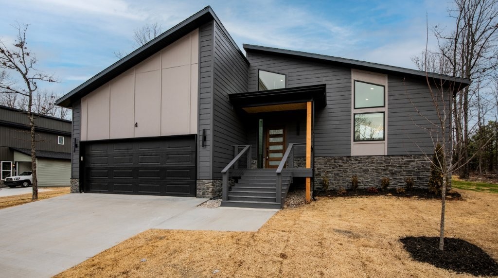 Bella Vista beauty showcasing modern architecture, upgraded finishes, and a fantastic floor plan. Soaring vaulted ceilings and a cozy fireplace anchor the living room, complemented by abundant cabinetry and windows throughout. Enjoy a flat backyard and a bonus room with a closet—ideal for an office, guest space, or flex room. Located just 1/4 mile from Branchwood Recreation Center with pool, gym, tennis, playground, biking trails, and pickleball; 5 minutes from Highlands Golf Course; and only 20 minutes to Bentonville and the Walmart Campus via the new Bella Vista Bypass. Experience Bella Vista’s scenic beauty while staying close to everything.