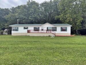 Introducing a charming three-bedroom, two-bath home in Berryville, Arkansas. This manufactured home on a permanent foundation sits on a spacious 0.41-acre lot and features a new metal roof, wood floors, and a cozy fireplace. With a carport and a warm atmosphere, this property offers both comfort and convenience. Don't miss your chance to own this lovely home in Berryville, Arkansas. Contact an agent for a viewing today!