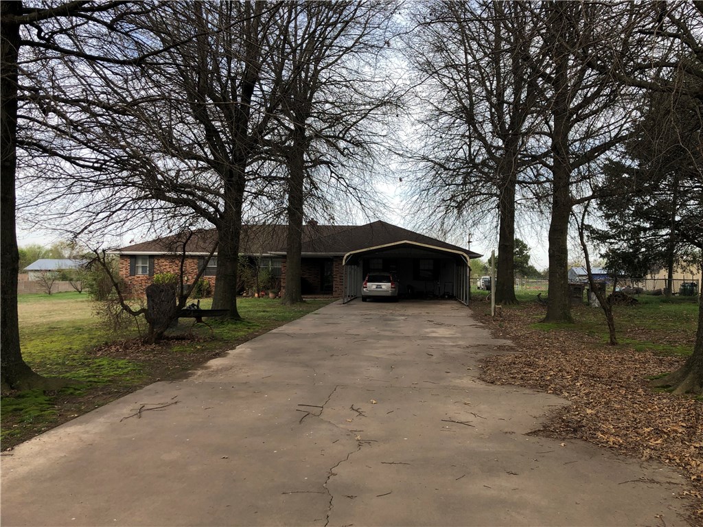 Great location with 2 acres.  4 bed, 3 full baths, large living area with split floor plan.  Nice sunroom or office and large kitchen.  Oversized master bedroom with whirlpool.  3 large out buildings.  Property qualifies for RD.  Priced to sell!