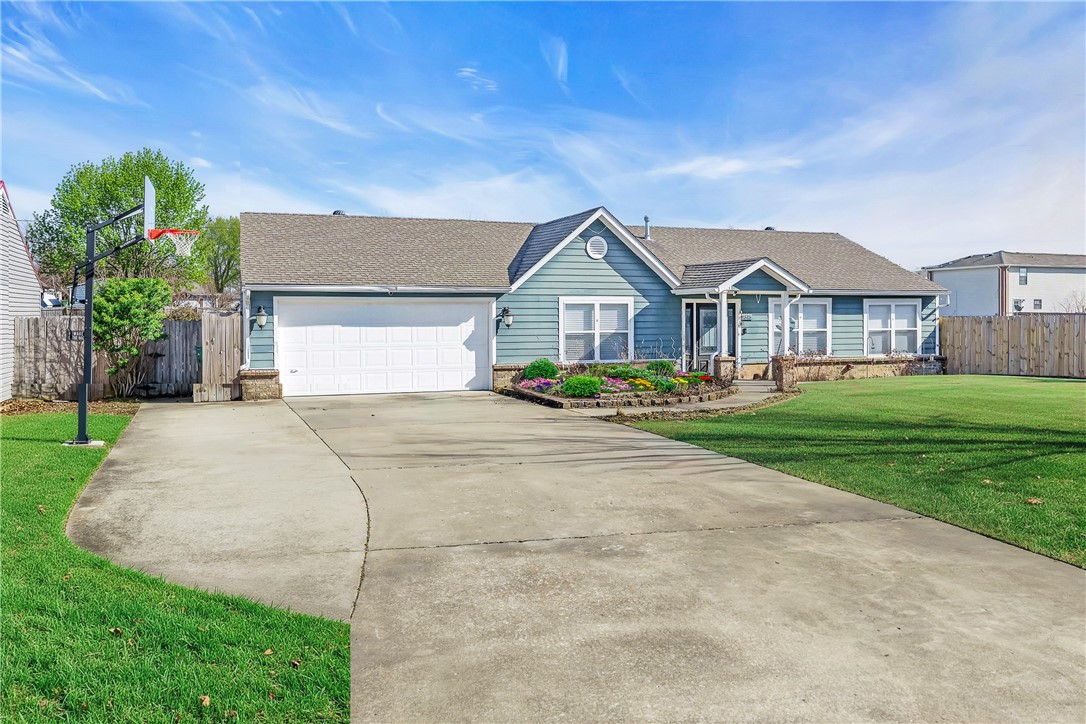 Welcome to 2315 S 17th Street, a charming 3-bedroom, 2-bath ranch home in the desirable Willowbrook neighborhood! This well-maintained 1,432 square foot home offers comfortable single-level living with modern conveniences throughout. The open floor plan features beautiful tile and wood laminate flooring, while the kitchen comes equipped with stainless appliances including a glass cooktop and vent hood. You'll love the energy savings from the Solar Panels that will convey with the home at closing! The spacious master suite includes a walk-in closet, and the efficient tankless water heater ensures endless hot water. Step outside to your private backyard oasis, complete with a patio and wood privacy fencing that backs up to an open field—perfect for relaxing or entertaining without feeling overlooked. The 2-car attached garage and concrete driveway provide convenience, while the location near Rogers High School makes this ideal for families. Don't miss this opportunity to own in one of Rogers' most sought-after areas!