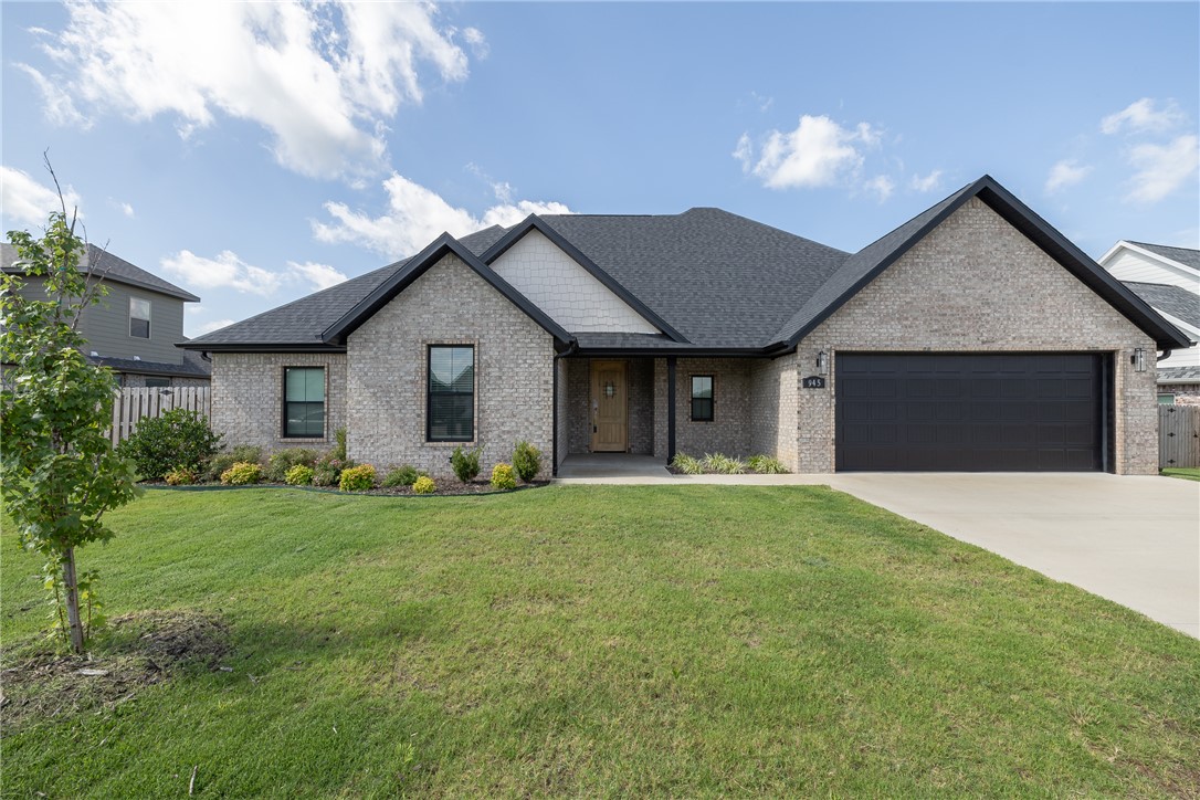 Adorable MOVE IN ready home in Tontitown’s South Pointe S/D. 2,520 heated and cooled sq ft offers 4 bedrooms, 3 full bathrooms, open eat in kitchen to living, dining, bonus room, and a laundry room. Amenities include luxury vinyl plank flooring, vaulted ceilings, quartz counter tops, gas range, stainless appliances, 2” faux wood blinds,  gas log fireplace in the great room, fully privacy fenced backyard, covered patio, and a 2 car garage. The only room upstairs in this home is a bonus room so most of the living is on the first floor!!!! Zoned for Harber High School!