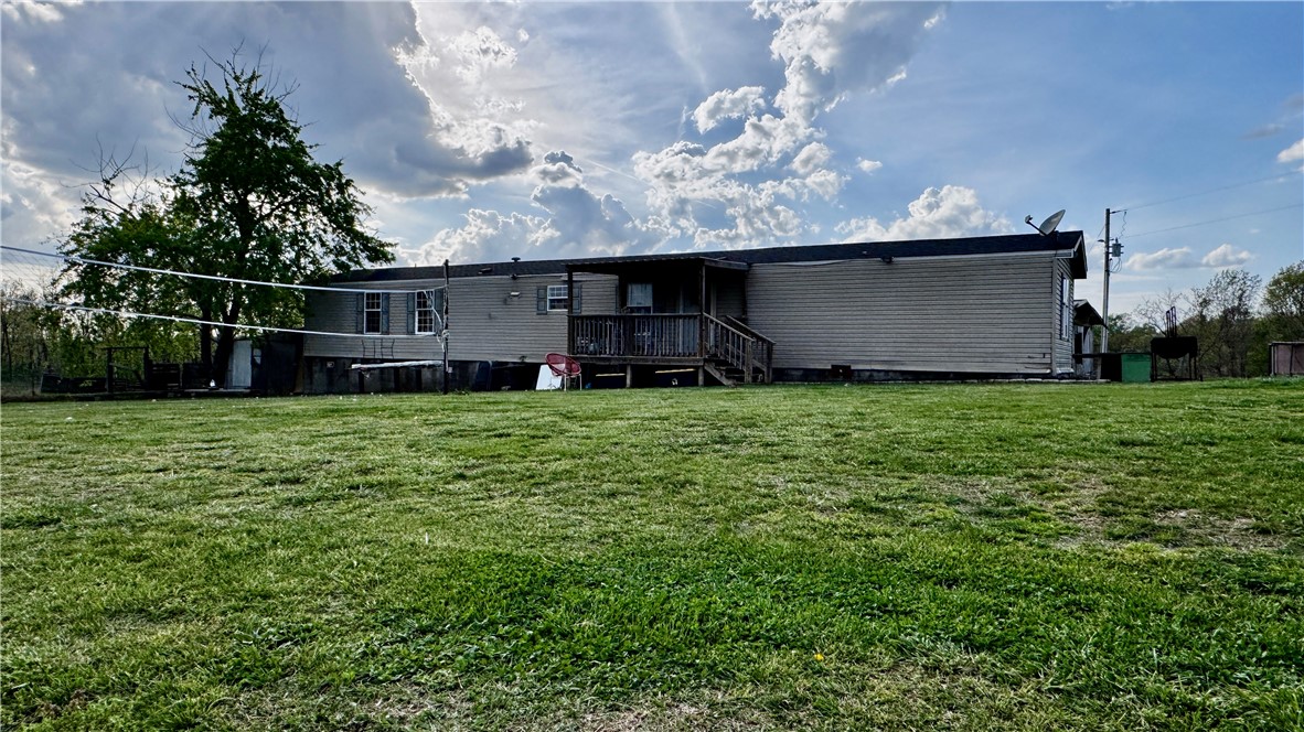 Just 2.6 miles from Rogers, this beautiful 5.58-acre property offers mostly flat land and plenty of usable space. The home features a permanent foundation, with major updates including a new HVAC system (2026), updated bathrooms (2025), and upgraded flooring (2025). Additional improvements include updated lighting (2024) and access to city water. A direct water line makes this property an excellent opportunity for gardening or small-scale farming.