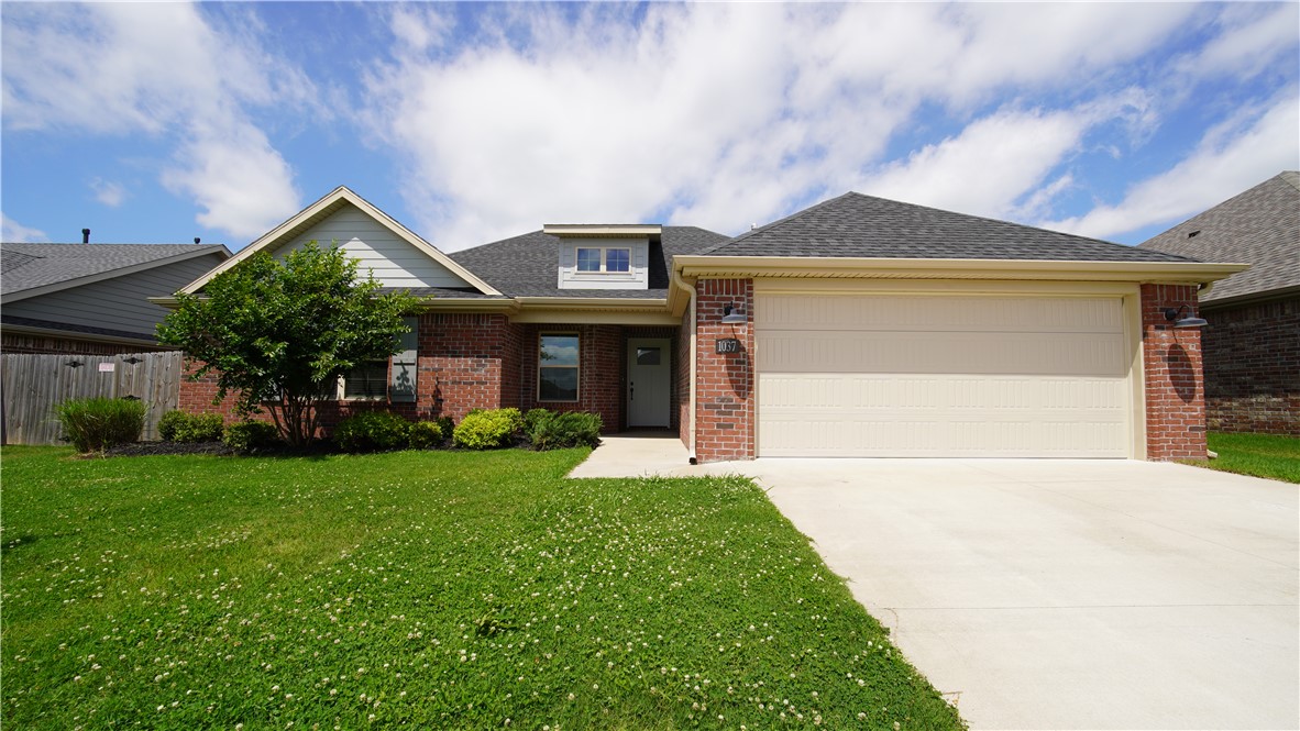 Located in the beautiful Hickory Meadows Subdivision, which boasts a resort-style community pool and park area with a playground, this 3-bedroom, 2-bath home is the ideal family home. As you walk up, you're greeted by an elegant entryway featuring a Craftsman-style front door. The living room boasts a beautiful brick natural gas fireplace. The kitchen offers plenty of granite counter space, a pantry, custom cabinets, a stainless steel appliance package, and a plumbing stub-out for a gas range. This split floor plan also provides a spacious owner's retreat with a whirlpool tub, separate shower, and walk-in closet. The laundry room isn't to be overlooked either, with ample cabinetry and counter space, as well as a built-in mud bench as you come in from the garage. Last but not least, you'll appreciate the convenient location with easy access to the Highway 112 corridor, the new 412 relief route, and both Siloam Springs and Springdale. Let's make this house your home! Schedule your private tour today.