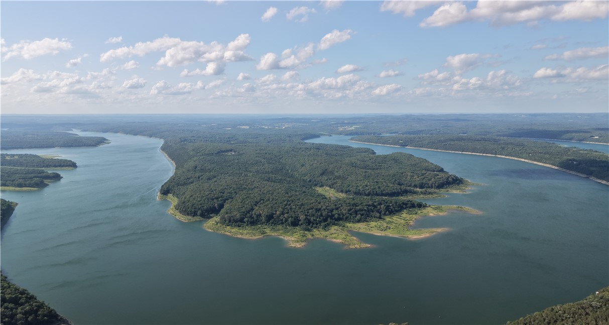 Rare opportunity to own 112 acres m/l in the highly sought-after Timber Shoals Ranch community of Boone County, Arkansas. This is the last remaining parcel of this size available in the development, offering an unmatched combination of privacy, recreation, and investment potential. Bordering Bull Shoals Lake and featuring access to a secluded private cove, this property provides a rare waterfront setting with breathtaking Ozark views. The rolling terrain offers multiple potential building sites, abundant wildlife, and endless opportunities for outdoor enjoyment. Ideal for a private estate, hunting retreat, family compound, or long-term investment, this property is conveniently located near world-class fishing, boating, and recreation. Situated within a well-maintained development with protective covenants designed to preserve property values, this exceptional tract offers the perfect balance of seclusion and accessibility.