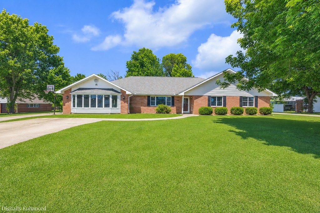 Exquisite home in the Apple Meadows Subdivision! Wonderful living space with vaulted ceilings and beautiful natural light pours through the home. Dazzling eat-in kitchen is equipped with an abundance of custom cabinetry and center island providing functionality for multiple cooks. Recently updated with fresh paint, fixtures and LVP flooring. Open Split bedroom floorplan offers spaciuos bedrooms, while providing privacy and practicality to all. Massive primary room boasts gorgeous windows, large tub, and separate shower. Direct access to backyard from primary bathroom. Nestled on large lot with covered patio and fully fenced backyard is ideal for the little ones to play. Grand 30 X 40 detached shop has 2 large roll-up doors, vehicle lift and room for all your projects. Additional storage can be found in the shed. Excellent location with convenient access to 71-B and I-49. Move in ready and waiting for you!