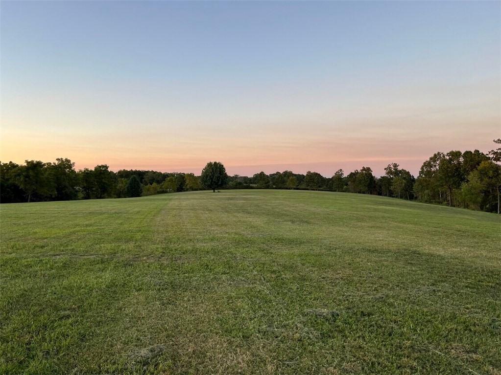 Prime land for commercial development at the intersection of I-49 & Hwy 72 in Gravette. Two adjoining parcels (11-00002-378 & 11-00002-386). Great visibility and access. All utilities available except sewer. Strong investment opportunity.