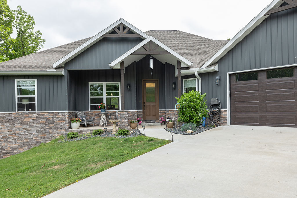 Walk to Bella Vista’s Lake Loch Lomand! Custom one level home offers Formal Dining + Casual Dining, Home Office, bicycle workshop and bonus flex space. Spacious living area filled with natural light. Double glass doors provide a beautiful treehouse view. Designer kitchen has large island, wine cooler, 6-burner gas range, wall mount vent hood, and a water filtration system at the farmhouse sink. Full house Culligan water softener system. Oversized Primary Suite; amazing ensuite with heated floor, separate vanities with vessel sinks, two walk-in closets, water closet, soaking bathtub and walk-in tile shower with rain showerhead. Gated, graveled area to hide toys like an RV or boat. Take in the beauty of Northwest Arkansas from the massive 2-tiered deck while enjoying the Balboa Swim Spa; turn the motor on for laps of just relax as a pool. Deck has fall/winter/spring view of lake. Private setting, large cul-de-sac lot. Convenient to golf, hiking and bicycle trails – only 9 miles to new OZ Trails Bike Park.
