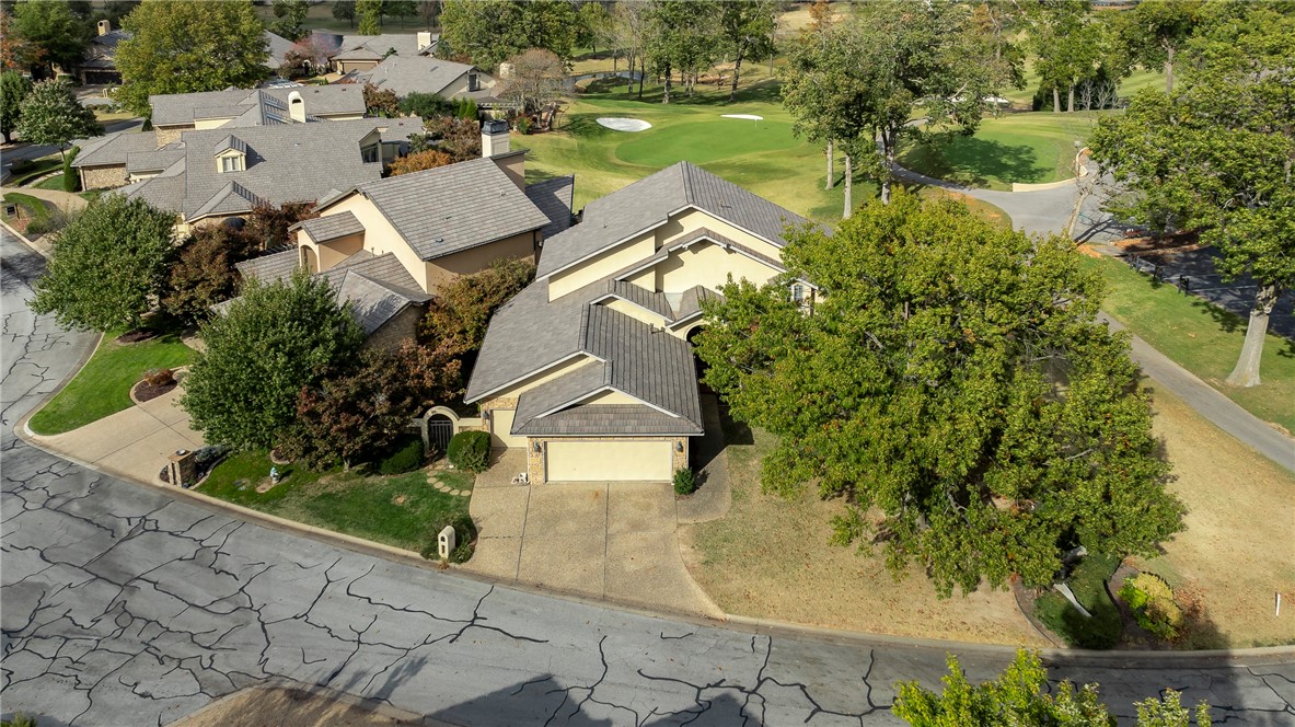 Welcome to this stunning villa in the prestigious Pinnacle Country Club subdivision! Nestled alongside the 9th hole of the renowned golf course & just steps from the clubhouse, this 3-bedroom, 3-bath, 3,566 sq. ft. home offers a luxurious blend of comfort & convenience. The open concept living area invites you in with serene golf course views, and with an abundance of natural light, thanks to large windows throughout. The kitchen boasts ample counter & storage space, perfect for hosting & entertaining. The primary suite offers a private oasis on the main floor, while the two additional bedrooms provide plenty of room for guests. The two-car garage includes a dedicated golf cart bay for easy access to the course. Location is key! You’ll be minutes away from shopping, restaurants, medical care, the Walmart Home Office, AMP, Top Golf, and direct access to I-49 and the area’s extensive trail network. Experience the best of Northwest Arkansas, right from your new home at Pinnacle Country Club!