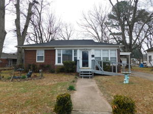 This home is located to ensure convenience to shopping, doctors and hospital.  Many updates include vinyl flooring, counter tops and backsplash, interior paint and more. Oversized screened porch to enjoy the spacious yard. 2 living areas with gas log fireplace. Fenced backyard. NEW ROOF 2021!No Disclosure this is an estate.