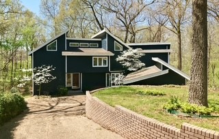 If you’ve been searching for a spacious home with character, flexibility, and big potential to add your personal preferences—this is it! Located at the end of a lovely wooded cul-de-sac, this Siloam Springs fixer-upper features 4 bedrooms, 2 full baths, a loft, and multiple main-level rooms that can serve as bedrooms, offices, or hangout spaces. The layout is ideal for a large family or anyone needing room to grow. Cathedral ceilings and generous natural light highlight the home’s unique charm. Outside, enjoy wooded views, a quiet setting, and room to entertain. A sprinkler system and generator add value and peace of mind. Some interior projects were left unfinished, allowing the next owner to put their personal touch on the home and build equity with every improvement. Just 7 minutes from the historic and vibrant downtown of Siloam Springs, this home offers a rare combination of privacy, space, and opportunity!