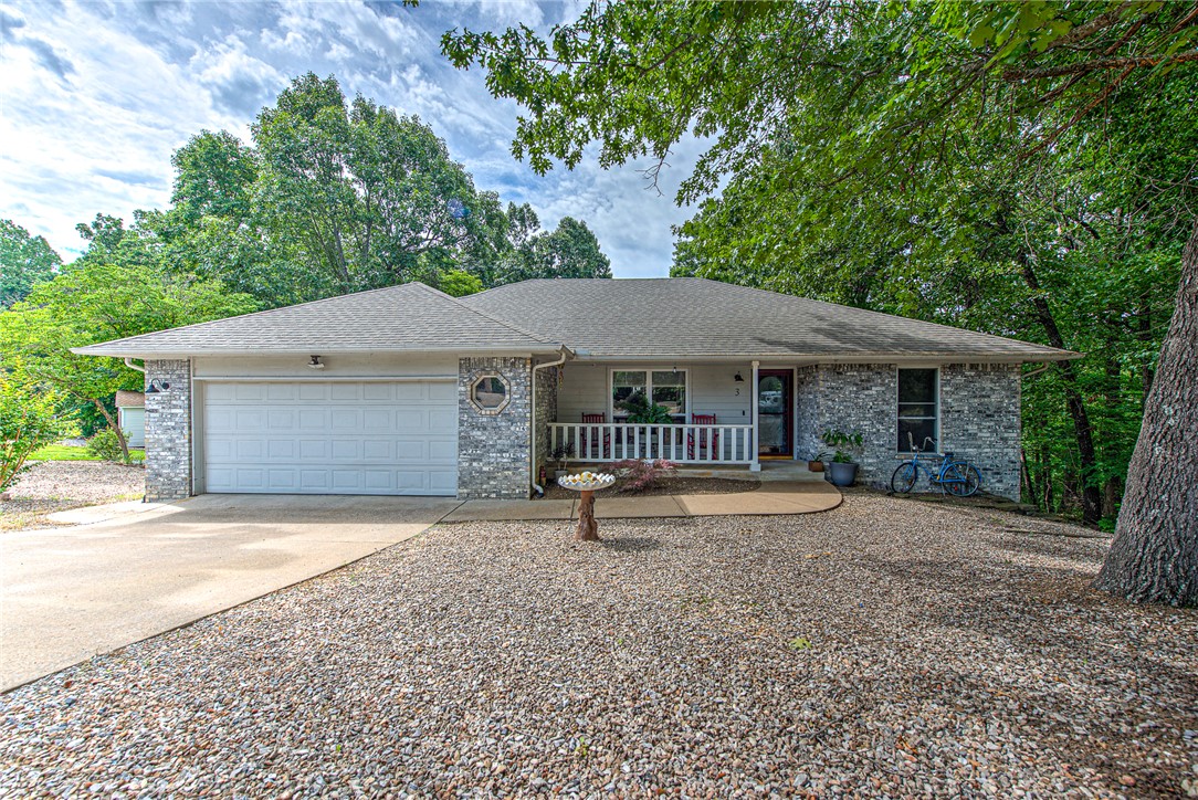 This home is conveniently located just W of Forest Hills.  Enter with a large roomy living area w/cathedral ceiling, (recently painted ceiling & walls).  Large island kitchen with walls of cabinets and ample room for a good size dining.
This split floor plan has the laundry tucked at the end of the hall just off of the primary suite.  The back covered patio leads down to a lower level 594' specialty room.  This versatile area is heated & cooled with 1/2 bath, windows and walk in entry for shop, crafts, extended living... (not included in the upper living sq. ft.)