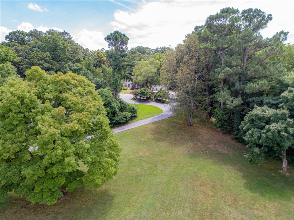 Elegant estate with beautiful park/like setting. You can stroll thru siloam park to the downtown restaurants & shops or go up the hill to john brown university.  You will love the towering windows & exceptional views. Want to go relax? Head outside and sip lemonade at any of the 5 outdoor patios. Bask in luxury among the towering trees, landscaping & flowers. Perfect place to entertain with plenty of room for everyone inside and out. 2 wonderful living rooms off the beautiful entrance.  Exquisite crown molding everywhere you look with lots of built-inn shelves & drawers as well as a see-thru custom china closet.  Master suite has it's own living area as well as a romeo & Juliet balcony.  You won't find a home like this anywhere as everything is custom.  It is truly a one of kind beauty. You won't be disappointed. Original log cabin was built in 1904.  All that is left is the chimney. Sellers added and rebuilt everything else in 1995. Masterfully planned to perfection.
Motivated sellers with huge price reduction!