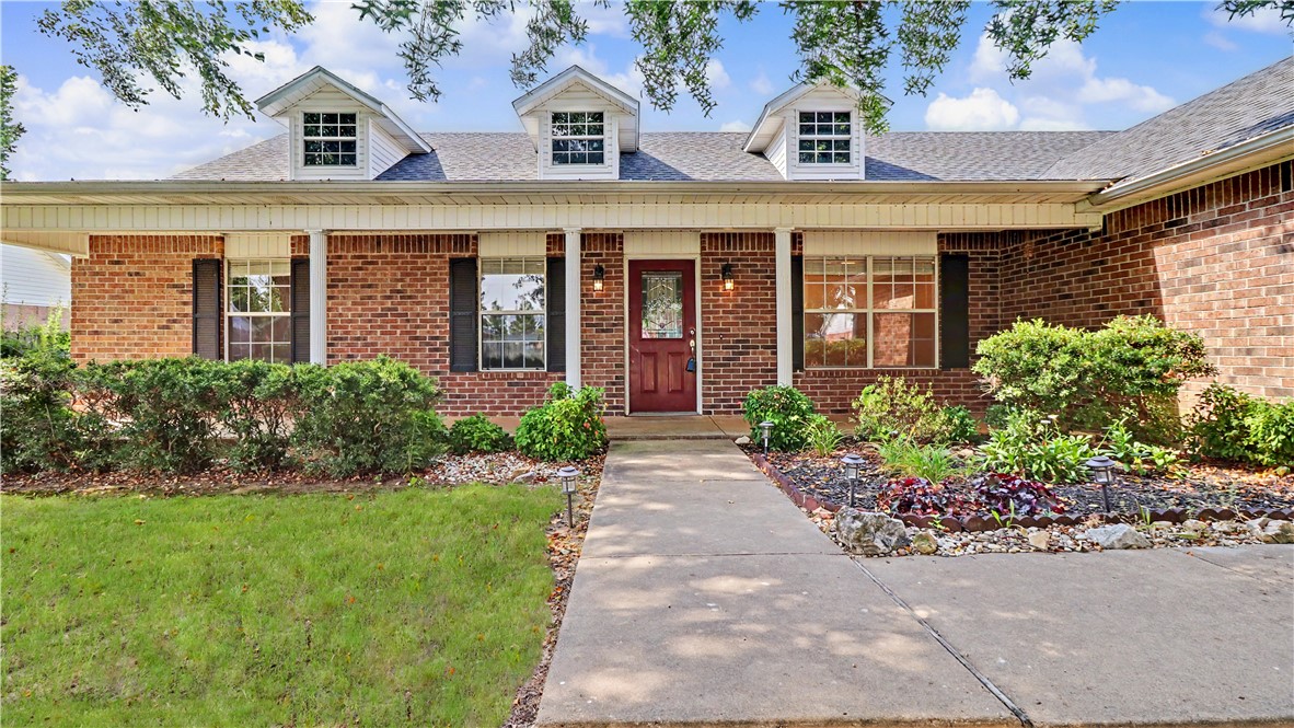 3 bedrooms and a small office enhance this ranch style split floor plan. Beautiful covered front porch welcomes you to the interior finishes that include lovely wood floors, granite counter tops and upgraded backsplash, a custom fireplace mantel, vaulted ceiling in living room, and more! Formal dining area and breakfast nook.  Primary bedroom has 2 closets, whirlpool bath and walk in shower. Fenced back yard has green space behind it so you aren't looking directly at the neighbors behind you. Great location. Close to schools and trails. 2 car garage with utility sink.