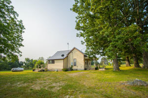 Perfectly located minutes from town with that country feel.  This 2 bedroom 1 bath home sits on 2 beautiful acres.  Home has rural water but also has a well on property.  Roof is 3 years old and HVAC is 2 years old.  Includes propane heat as an alternative heat if you should need it.  Such a cute house!!
