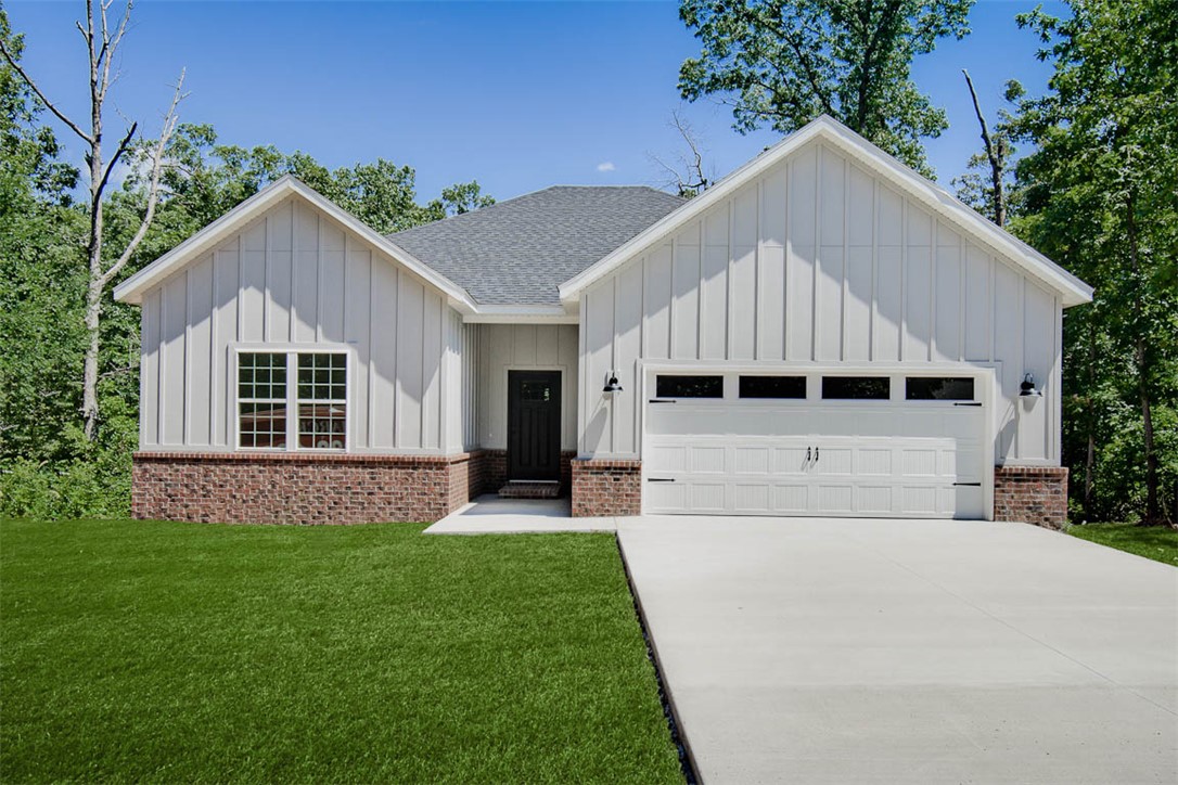 New construction on a flat .35 acre cul-de-sac lot just down the street from Branchwood Recreation and Nature Trail! Also located within close proximity to Highlands Golf Course, Lake Loch Lomond, and I-49. Step inside to discover an inviting open concept design featuring 10’ ceilings and beautiful floors that enhance the spacious feel of the home. NO CARPET. The stylish kitchen is equipped with a gas range, 3 cm quartz countertops, custom cabinets, and a walk-in pantry. Entertain or unwind in the living area, complete with a stunning fireplace, or step out onto the covered patio to enjoy the peaceful surroundings. The primary suite features a massive walk-in tile shower and closet.