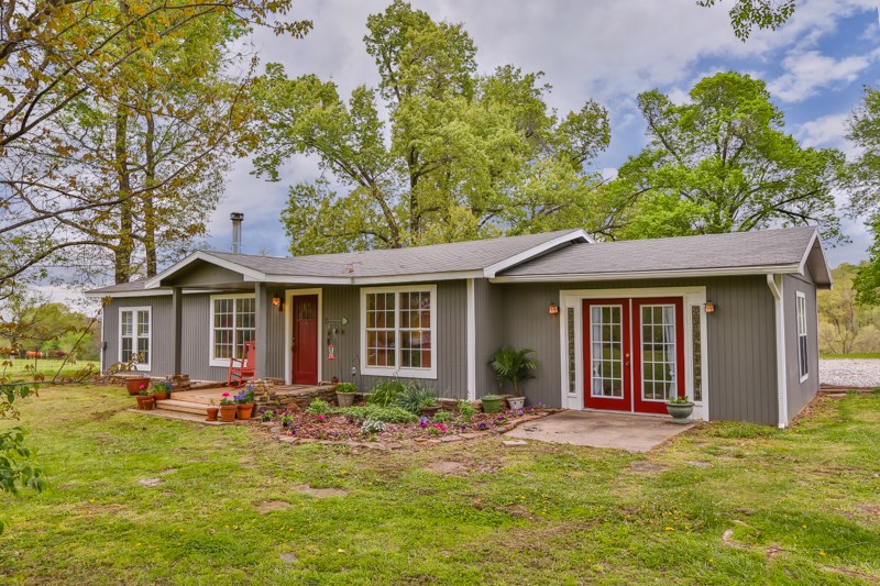Great country living on 3 acres with a guest house and shop! Main house is 1496 SF, 2br-2ba-2 living areas (one could be easily made into 3rd bedroom). Large master bedroom with large walk-in closet. Cozy woodstove in the living room. Guest house is 544 SF, 1br-1b. Both with new heat & air and exterior paint. Move-in condition. Shop appears to be fully insulated set-up for a wood stove. Old mature oaks. Enjoy the beautiful sunsets from the covered back porch along with the peace & quite of country living!
