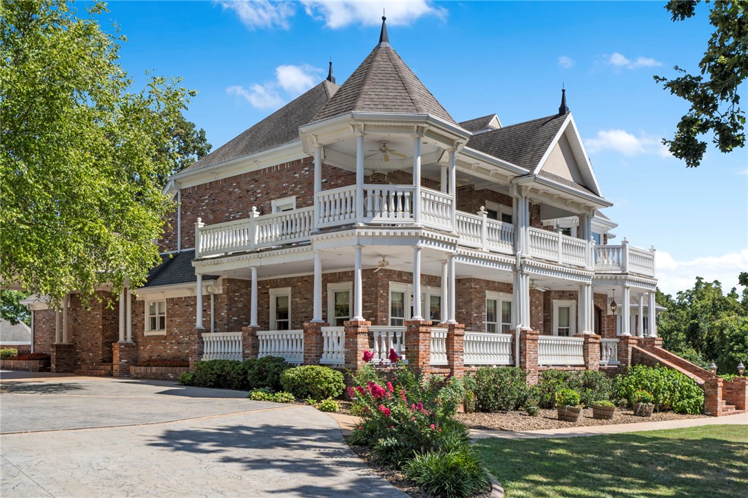 Nestled behind custom gates on 5 private acres, this extraordinary custom-built estate offers a rare blend of luxury, privacy, and versatility just 19 minutes from downtown Bentonville. Australian Cypress hardwood floors, Italian marble, and a breathtaking repurposed stained-glass window create a stunning first impression. Designed for entertaining and everyday living, the home features a private theater, game room, fitness room, spa retreat, and wine cellar. Expansive indoor and outdoor living spaces provide the perfect setting for gatherings, weddings, corporate retreats, and special events. Outside, enjoy a resort-style in-ground pool, pool house, and beautifully manicured grounds surrounded by peaceful countryside views. An apartment above the garage offers guest accommodations, multi-generational living, or potential rental income. Energy-efficient and low-maintenance, this one-of-a-kind estate delivers an unmatched lifestyle with endless possibilities.