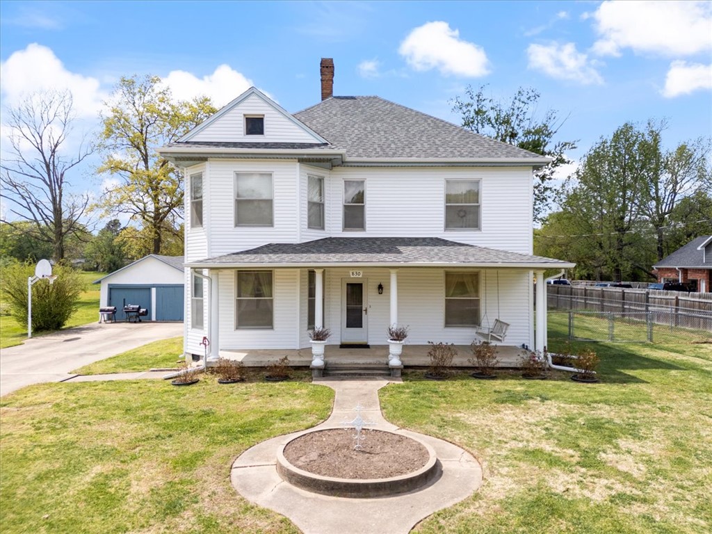 Own a piece of history in Siloam Springs! This incredible home, est to have been built around 1900, has been lovingly cared for & thoughtfully preserved. Many original features remain, incl stunning doors, detailed woodwork, vintage hardware, & unique fixtures that showcase its timeless character. Offering 5 bedrooms & 2 full bathrooms, the layout incl one bdrm on the main level & four upstairs, w/ two separate staircases providing convenient access. The main floor feat two spacious living areas, a large formal dining room, & a functional kitchen—perfect for entertaining. Situated on nearly an acre, this property offers in-town convenience with a peaceful, country-like feel. Step out onto the back deck & take in the beautiful western sunsets, or enjoy your morning coffee while listening to birds & watching deer pass through the serene, private backyard setting. Additional highlights include a NEW roof & siding, updated plumbing & electrical, & the original carriage house still standing on the property.