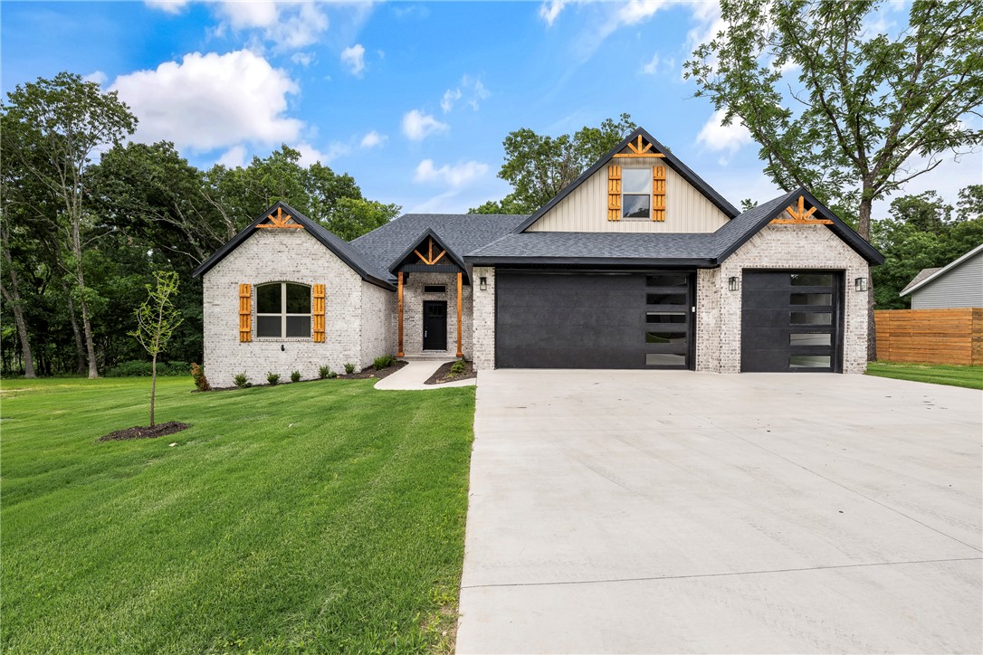 Amazing find-- NEW CONSTRUCTION completed by June 1--This elegant estate home sits on 2 lots (0.6 +/- acres) near Loch Lomond. You will be impressed by all the high-end finishes in this split bedroom open concept floorplan. Main level includes Spacious living area with gas log fireplace, gorgeous beams, & hardwood floors. Gourmet kitchen features quartz countertops, loads of custom cabinets & waterfall island. 2 guest rooms + office. Primary suite with spa-like bath hosts custom tile shower, soaker tub and dual vanities. Primary closet connects to utility area. Upstairs you will find a Media room & 1/2 bath. Enjoy nature on your massive covered deck all overlooking your backyard oasis. Prewired for whole home Generac generator.