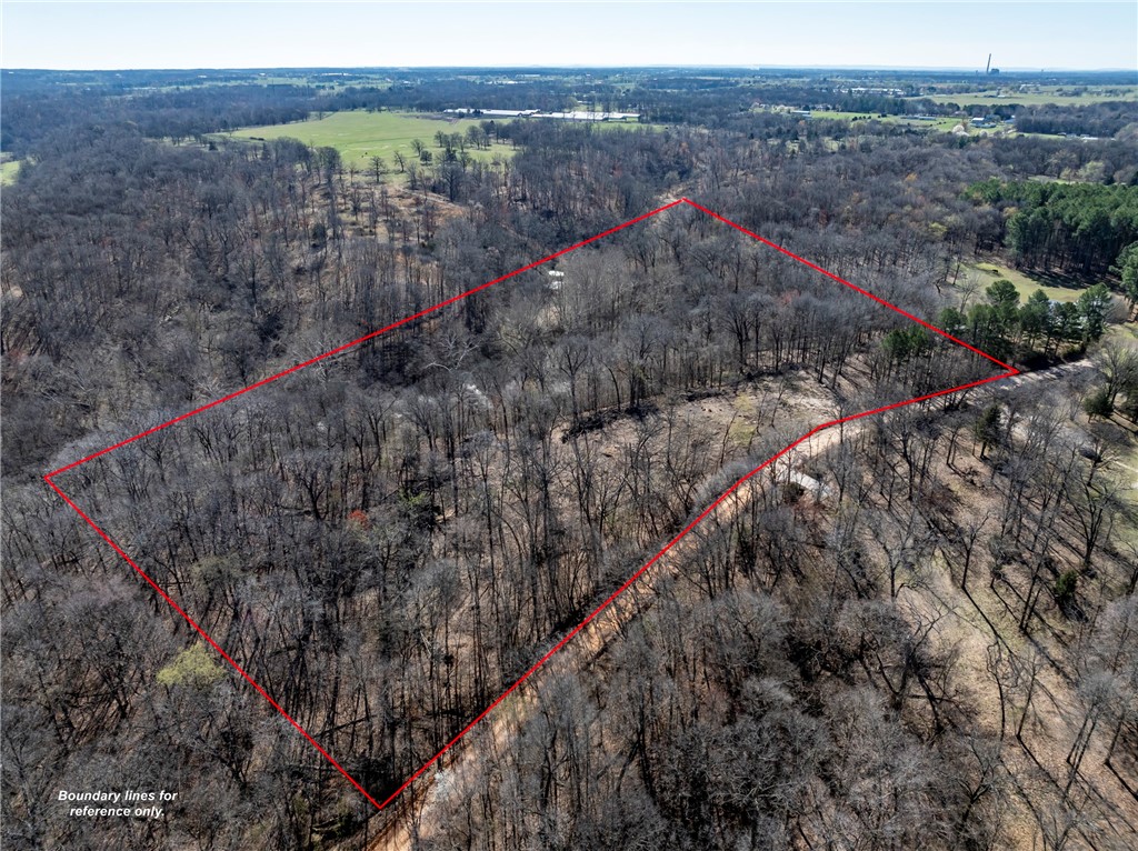 Beautiful views, quiet and serene...Perfect place to build your home. Almost 8 acres outside the city with seclusion. Some clearing has been done. Ready to go with utilities, including water at the road. Don't miss this opportunity to make this place your own!