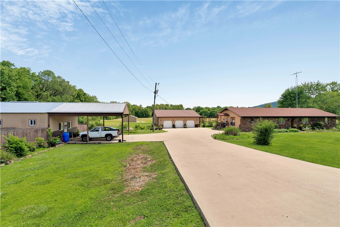 Nice one-owner home on 24.29 clear acres with many outbuildings. 12-kennel dog facility for boarding or training dogs. Two 3-car garages, one with a large party room in the back that could be a studio apartment. The home has 2 living areas and a large room that could be an office, or add a closet and make it a fourth bedroom. Huge covered patio is perfect for large gatherings.
