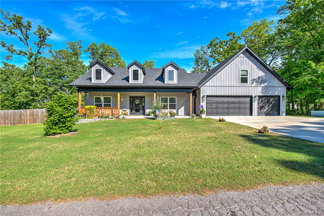 Tucked into the natural beauty of Bella Vista, this nearly new 2 bed, 3 bath home sits on a level .32-acre lot. A dedicated office and upstairs bonus room offer flexible living space. Inside, enjoy tall ceilings and an open-concept layout with a split floorplan for added privacy. High-end finishes shine throughout—custom cabinets, 3cm quartz counters, gas range, fireplace, and a luxurious primary suite with a freestanding tub and walk-in tile shower. Step outside to a low-maintenance backyard with a serene above-ground pool and deck, perfect for relaxing in nature. Don't miss the 3-car garage with epoxy floors. Conveniently located near Loch Lomond and Scotsdale Golf Course.