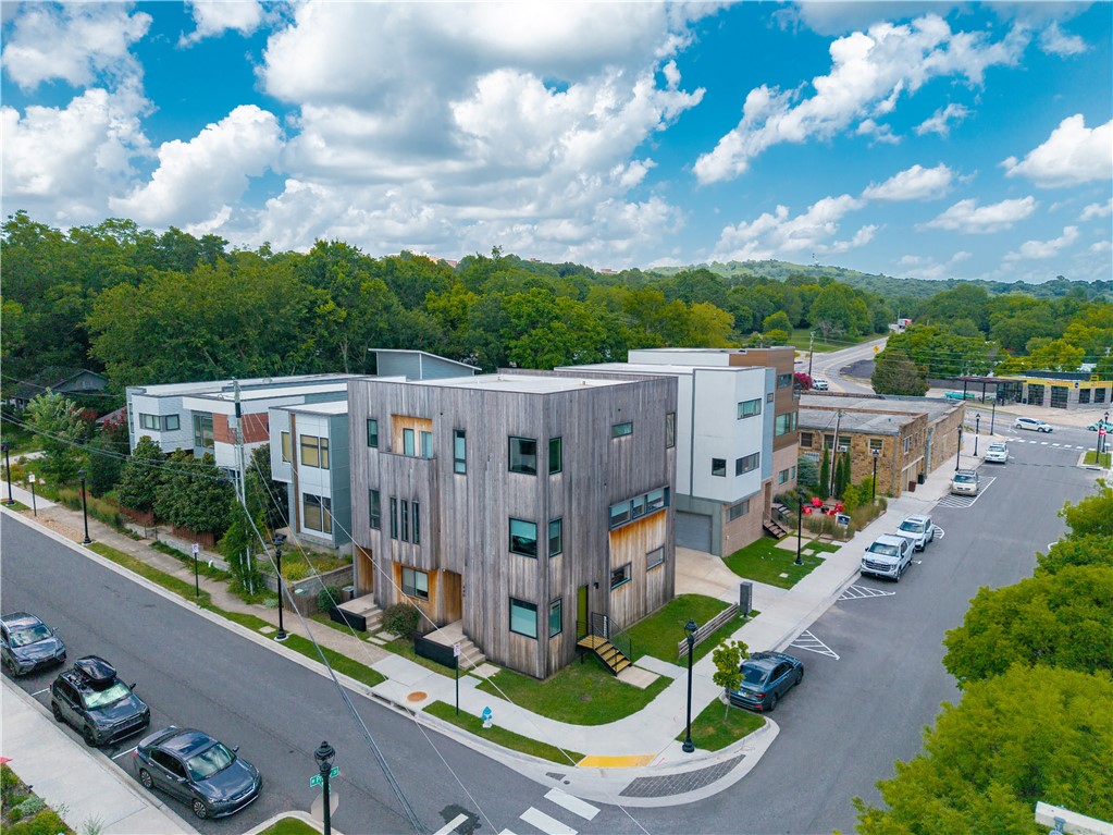 Rare opportunity to own a modern duplex in the heart of downtown Fayetteville! Live in one side and rent the other, lease both units, or keep one for guests. Enjoy quick access to local restaurants, coffee shops, bakeries, grocery stores, the Fayetteville Square, Farmers’ Market, Dickson Street, and the U of A, with the Razorback Greenway just steps from the front door. Each unit includes an attached two-car garage. Unit 440 offers two bedrooms, two full baths, and a downstairs office. It has been completely remodeled with custom rift-sawn white oak cabinetry by local Ivy Cabinets, solid red oak floors, red oak window frames, and solid wood trim. Unit 436 features three bedrooms, 1.5 baths, bamboo floors, and granite countertops. The third bedroom is on the first floor and has primarily been used as an office.  Exterior siding recently replaced with thermally modified pine siding.
