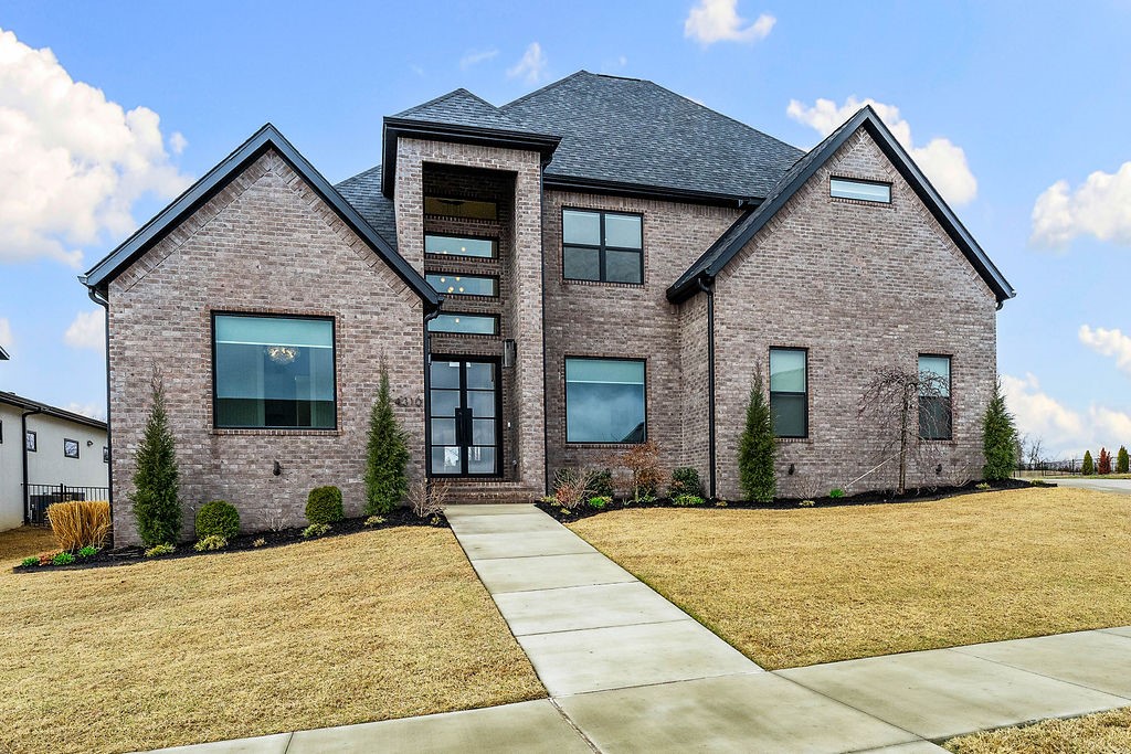 Luxury living meets breathtaking golf course views in this stunning home overlooking the 14th fairway In Shadow Valley. Designed for both entertaining & everyday comfort, the chef’s kitchen features upgraded Monogram appliances, including a built-in refrigerator & ice maker, and opens seamlessly to the dining & living areas. The living room showcases soaring 25-ft ceilings, a gas log fireplace and custom built-ins, creating a dramatic yet inviting space. The private primary retreat features a spa-like bathroom with large shower & soaking tub, an oversized custom closet & a hidden bonus office for added functionality. A dedicated office provides additional work-from-home space. Upstairs, enjoy a spacious game/media room with wet bar & wine fridge, perfect for entertaining. Additional highlights include a 3-car garage with EV charger & overhead storage. Step outside to a covered back patio with fireplace & take in the peaceful golf course views. Golf Membership conveys.