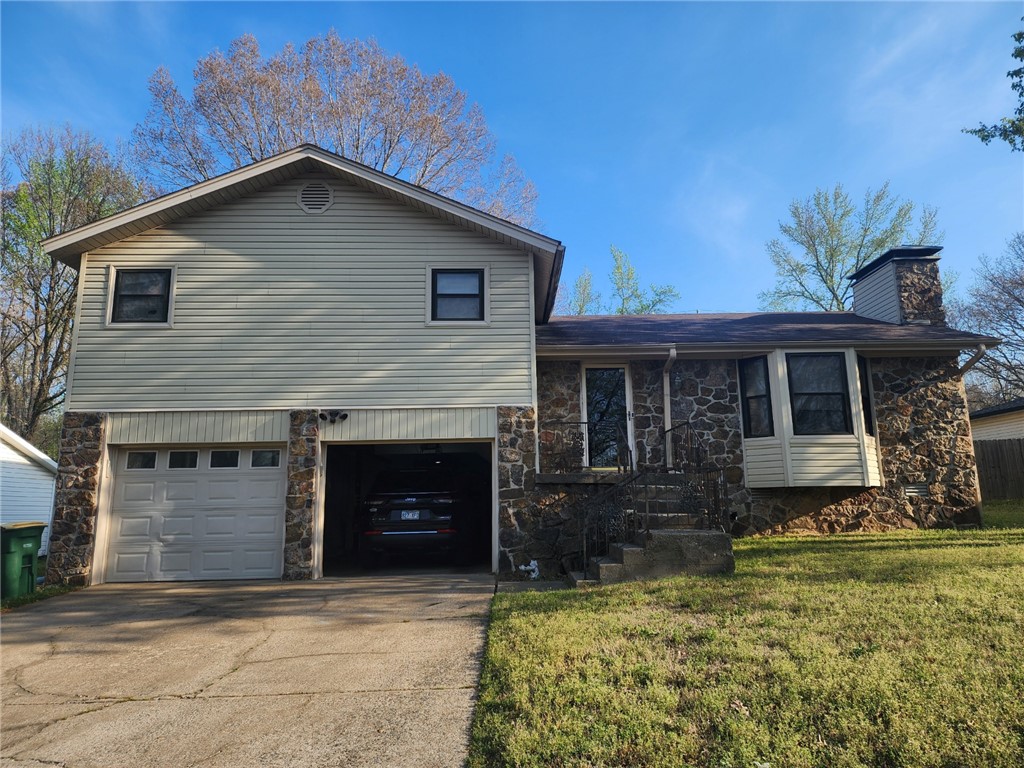 A unique split-level home situated on a spacious 0.21 (+/-) lot is ready for your tailored touch in Jacksonville. The centerpiece is a rock wall wrapped around a wood-burning fireplace that is perfect for enjoying family and friends on a cold day. The screened in covered back porch is ideal for relaxing or entertaining and keeping those pesky bugs away. This property offers great potential for buyers looking to personalize and update a home to their taste. With solid bones and a desirable layout, this is a fantastic opportunity to create your dream space.