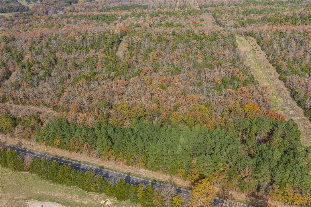 Room to build, hunt, ride ATVs, and breathe fresh air beneath the trees. Some properties give you room to build. This one gives you room to dream. Tucked just off Highway 23 North, this 9-acre property combining Tracts 2 & 3 offers the kind of privacy and natural setting many buyers are searching for. Whether you're envisioning a forever home, cabin retreat, weekend getaway, RV setup, or a place to enjoy outdoor recreation, this property gives you the space to create it. Enjoy being close to Booneville City Lake and MJ’s Bar & Grill, while still only a short drive from Cherokee Golf Course, Arkansas River access in Ozark, Blue Mountain Lake, Cove Lake, and the wineries of Altus. Bring your vision and explore the possibilities this River Valley property has to offer. Buyers encouraged to perform due diligence regarding utilities, inspections, easements, and intended use. MLS#1348874 is all tracts listed as a whole.