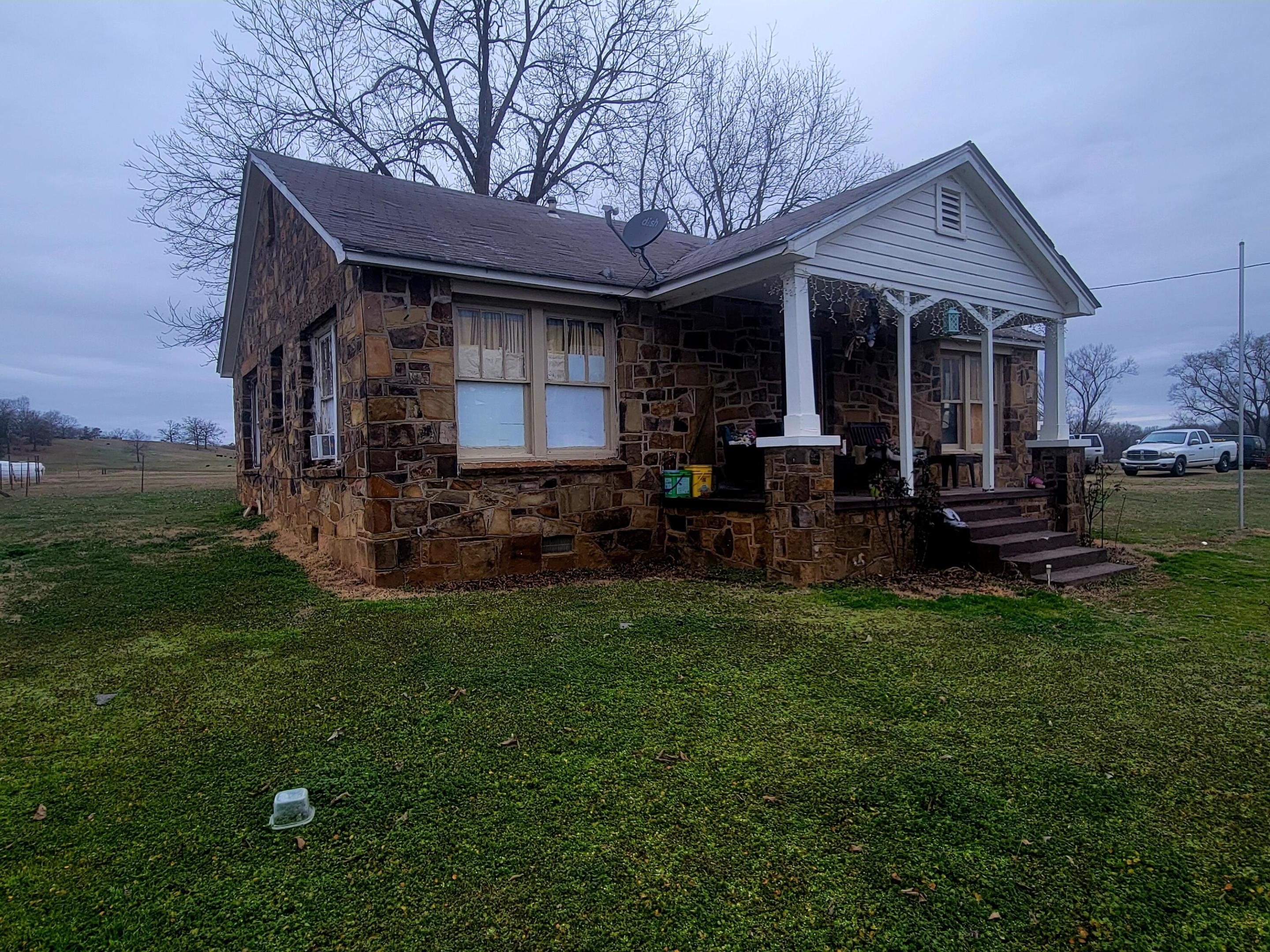 Charming Fixer-Upper on Spacious 0.85-Acre LotOpportunity awaits with this 3-bedroom, 1-bathroom rock home, nestled on a generous 0.85-acre lot. Full of potential, this property is perfect for investors or buyers looking to put their personal touch on a home.While the house is in need of repairs, it offers solid bones and plenty of character to restore or renovate to your liking. The large lot provides ample space for expansion, gardening, or simply enjoying the peaceful surroundings.Conveniently located with easy access to nearby amenities, this property is a rare find for those seeking a project with great potential. Seller is willing to complete up to $25,000 in repairs with acceptable offer.