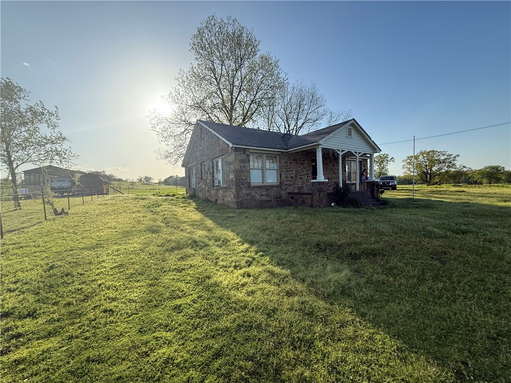 Charming Fixer-Upper on Spacious 0.85-Acre LotOpportunity awaits with this 3-bedroom, 1-bathroom rock home, nestled on a generous 0.85-acre lot. Full of potential, this property is perfect for investors or buyers looking to put their personal touch on a home.While the house is in need of repairs, it offers solid bones and plenty of character to restore or renovate to your liking. The large lot provides ample space for expansion, gardening, or simply enjoying the peaceful surroundings.Conveniently located with easy access to nearby amenities, this property is a rare find for those seeking a project with great potential. Seller is willing to complete up to $25,000 in repairs with acceptable offer.