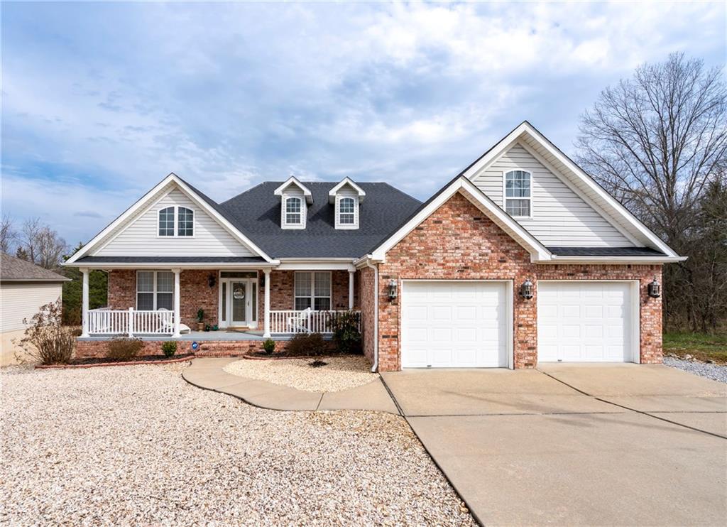 100% USDA-RD financing eligible! This beautifully maintained 3BD, 2BA home offering 2,372sf has it all! The home features brick/vinyl exterior & a low-maintenance rock yard provides classic curb appeal, perfect for easy upkeep. Covered porch with composite decking & steps. Inside features a spacious split plan with a combination of hardwood flooring, carpet, tile in wet areas. Pellet stove insert in living area. Formal dining. Primary bedroom has three walk-in closets, primary bath has dual vanities, soaker tub & tiled walk-in shower. Kitchen is fully equipped with all appliances, making this home move-in ready. A dedicated office space includes built-in wood desk & cabinetry, ideal for working from home. Downstairs a heated/cooled room provides the perfect space for hobbies, projects, or additional storage. HVAC replaced in 2022, roof appx 5yrs. Conveniently located near the trails of the Bella Vista Trail System, Scotsdale Golf Course & just minutes from Loch Lomond Lake. Enjoy all that Bella Vista has to offer!