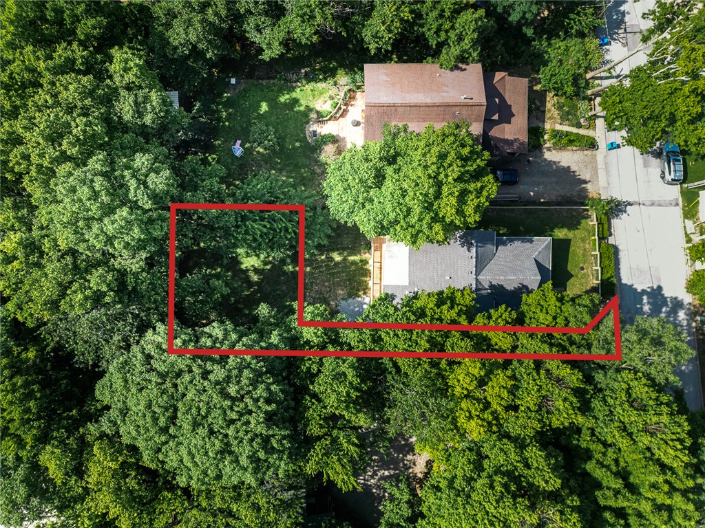Tucked away in the heart of downtown, this one-of-a-kind 0.10-acre lot offers a rare opportunity to build with sweeping southern views. Hidden behind a law office and accessed by a shared driveway, the property provides an unexpected sense of privacy while keeping you just minutes from everything downtown has to offer.

Its unconventional layout is exactly what makes it special. Whether you're envisioning a modern hillside home, a cozy retreat, or an investment property, this lot offers the chance to create something truly unique. Zoned Downtown General, the property offers flexibility for a variety of potential residential or commercial uses, subject to city regulations. Priced competitively, it's an affordable entry into downtown. Bring your vision and unlock the potential of this hidden gem.

Agent owned.