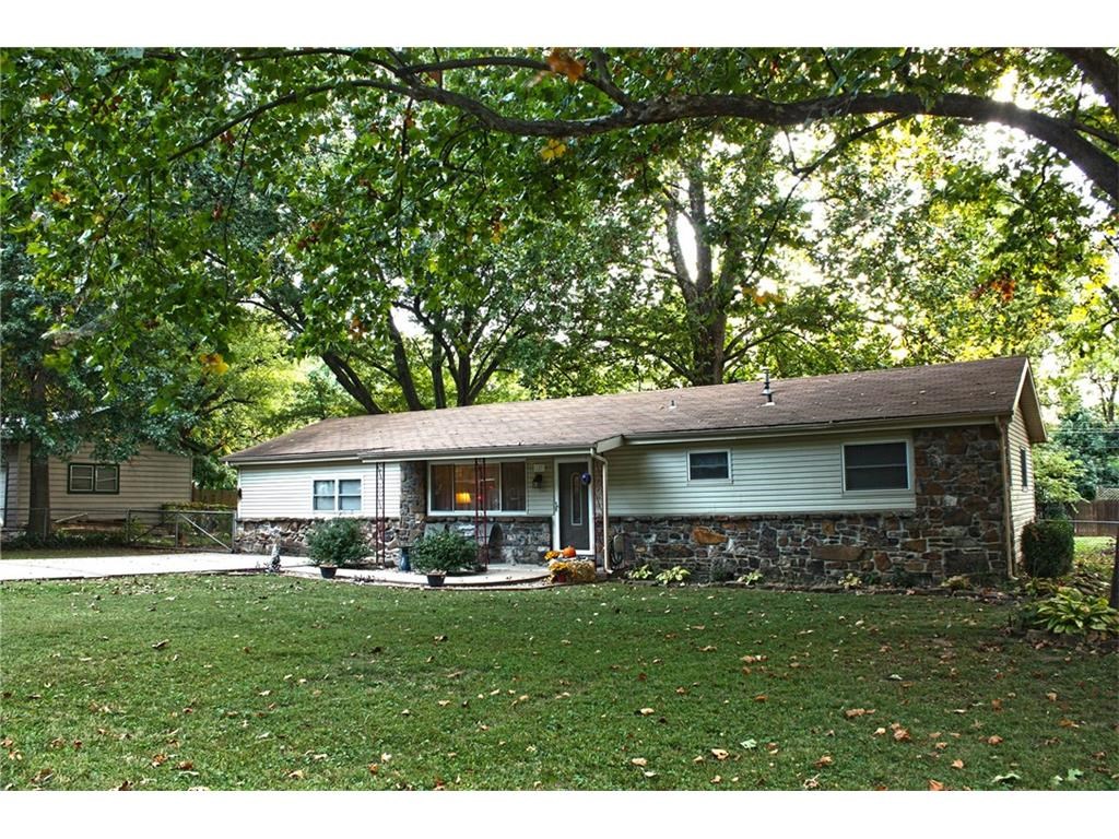 Immaculate home ready for a new owner to love. Farmington schools, but minutes from the hustle and bustle of Downtown Fayetteville shopping, restaurants, entertainment and the University of Arkansas. Beautiful kitchen remodeled in 2014 along with several other updates throughout the home including new HVAC in Nov. Enjoy sounds of nature from enclosed sun porch overlooking your kids and dogs playing in the large fenced backyard with several mature trees. Tinker with your hobbies the attached workshop.