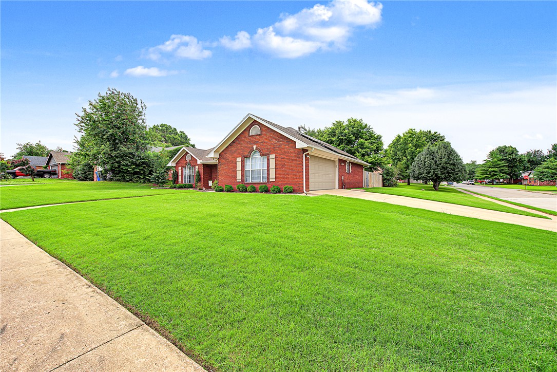 Move-in ready and beautifully updated, this well-maintained Fayetteville home sits on a spacious corner lot and offers comfort, style, and energy efficiency. Enjoy the benefits of paid-for solar panels, helping reduce utility costs from day one. Inside, you'll find an inviting open living area with a cozy fireplace, updated flooring, abundant natural light, and a functional layout perfect for everyday living. The kitchen features granite countertops, ample cabinetry, and a breakfast area overlooking the backyard. The generous primary suite includes a private bath, while additional bedrooms provide flexibility for family, guests, or a home office. Step outside to a large, fully fenced backyard with a covered patio, ideal for relaxing or entertaining. Conveniently located near schools, parks, shopping, dining, and the University of Arkansas, this home combines modern updates, long-term savings, and an excellent Fayetteville location.