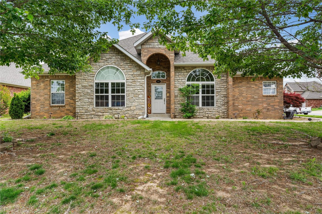 Charming home on a corner lot in a well-established Rogers neighborhood, conveniently located just minutes from Downtown, shopping, parks, trails, & Beaver Lake. This inviting split floor plan features a spacious kitchen, plenty of built-in storage, & a bright, welcoming sunroom. The beautifully landscaped yard includes a backyard storage building & a new garage door installed in 2024 adds to the home’s move-in-ready appeal.