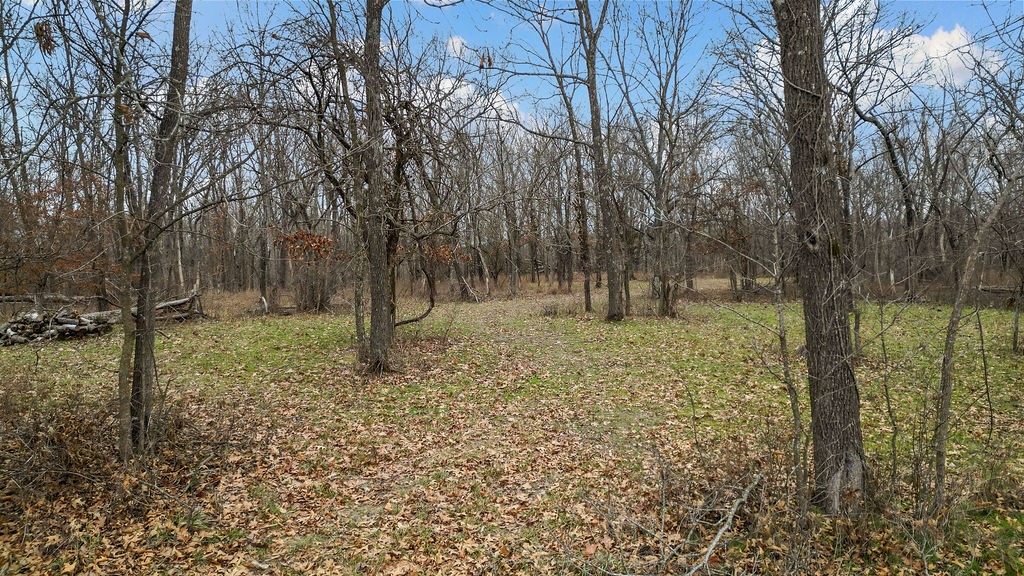 Nestled in a serene & sought-after area of Bentonville, this stunning lot offers 2.11 (+/-) acres of flat, buildable land, providing the perfect foundation for your custom dream home. Surrounded by mature trees, the property offers a peaceful and private atmosphere, while remaining conveniently close to Bentonville’s top amenities. This kind of gem is hard to come by—large, level lots like this are a rare find in Bentonville. Located just 0.6 miles from the nearby elementary & middle schools & only 1.5 miles from scenic hiking/mounting biking trails at Coler Creek, this lot offers easy access to ample outdoor recreation. The potential new McKissic Creek bike trail in the Bentonville Bike & Pedestrian Master Plan is located West of the lot. Whether you’re envisioning a private, luxurious retreat or a family home in the heart of a thriving community, don’t miss the chance to build your forever home in one of NWA's most sought-after spots! See Neighborhood association attachment for covenants and building guidelines.