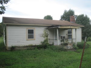What an investment opportunity!!!!  Hard to find 2 acres close to town... The house is just a bonus.  Once repairs are made, this could be the cute little home you have been searching for!