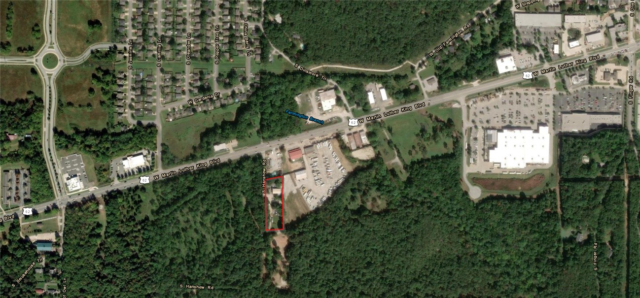 4 LOTS off West MLK +/- 1.9 ACRES
Introducing 1620 S Hanshew Road, Fayetteville, AR, a prime industrial and manufacturing investment opportunity. This 2,800 SF building, constructed in 2008, offers an expansive floor plan designed to accommodate manufacturing and distribution operations. With generous ceiling heights, efficient column spacing, high-capacity utilities, dedicated truck courts, and ample parking, this facility is tailored to support industrial tenants' needs. Its turnkey interior and durable construction materials make it ready for immediate occupancy, while the flexible floor plan allows for versatile industrial uses.
The property includes a 1470 sf Residential rental house. 
Don't miss out on this opportunity to invest in a premier industrial property in the West Fayetteville area.