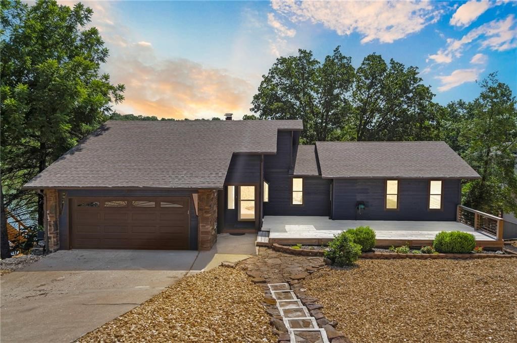 Welcome to your dream lakefront retreat on the coveted shores of Lake Windsor! This stunning,
renovated and updated 3-bedroom, 2.5-bath home is designed for both relaxation and entertaining, with
sweeping lake views. Enjoy direct access to the water with your own boat dock and sauna room, perfect
for unwinding after a day on the lake. Step inside to discover bright, open living spaces filled with natural
light from expansive windows and doors. Two fireplaces—one on each level—create a warm, inviting
atmosphere for cozy evenings. For those who love to cook and entertain, this property offers two full
kitchens! This feature opens up exciting possibilities, from a mother-in-law suite to an Airbnb
opportunity, making this home as versatile as it is enticing. This lakefront home is situated just minutes
from the interstate, bike trails(including the newly announced downhill bike park), dwtwn
Bentonville, and less than 20 minutes to the new Walmart Home Office. Don't miss the chance to own this
lakefront oasis.