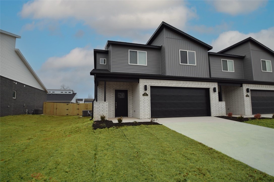 Newer modern design townhome in the heart of Centerton and close to Schools! Also included side by side stainless refrigerator, washer and dryer. This 3 bed 2 1/2 bath plan has a open living concept with tall ceilings and tons of natural light. Kitchen has granite countertops, stainless appliances, a large pantry, and a gas range. Primary bedroom is on the main floor and has walk-in closest. Two bedrooms upstairs with full bath and landing area. Luxury vinyl plank flooring throughout the 1st floor, 2" faux wood blinds, extra storage in the upstairs attic. Property has a private back patio and wood privacy fence. Owner must approve pets and no smoking.